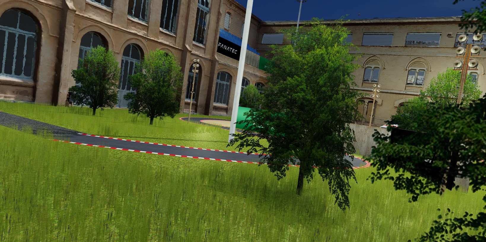 A 3D render of a racing track next to a building.